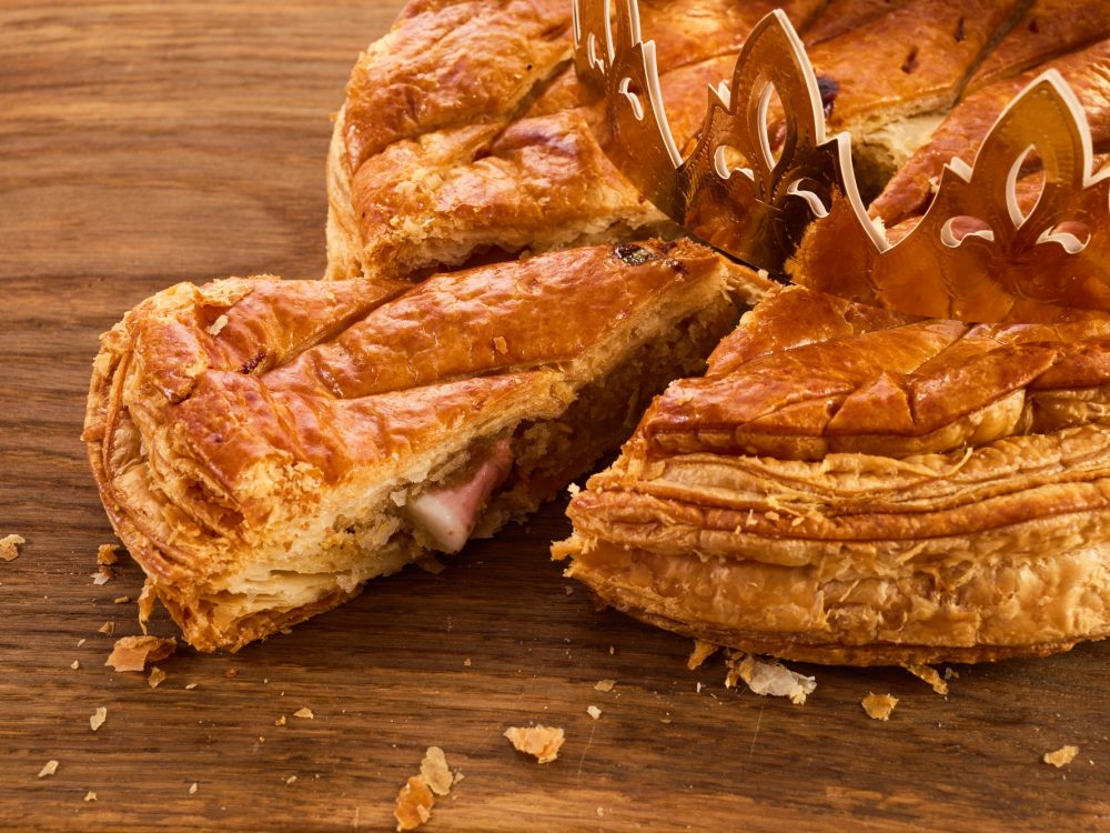 Galette des rois on wooden table.Traditional Epiphany cake in France